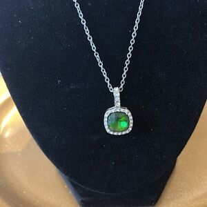 Lab Created Square Emerald Surrounded by Cubic Zirconia Stones On A Silver Chain